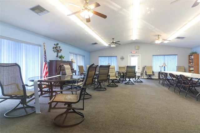 1221 S Pine Ridge Cir Unit A2, Sanford, FL 32773 - carpeted dining space with a ceiling fan and vaulted ceiling