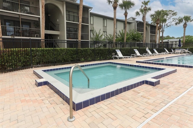1221 S Pine Ridge Cir Unit A2, Sanford, FL 32773 - community pool featuring a patio