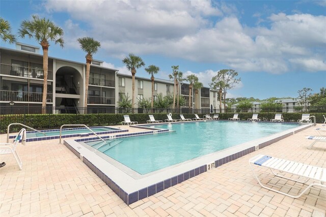 1221 S Pine Ridge Cir Unit A2, Sanford, FL 32773 - community pool with a patio