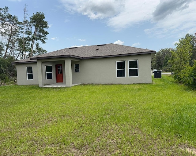 524 Marion Oaks Blvd, Ocala, FL 34473 - rear view of property featuring stucco siding, a yard, central AC, and a patio