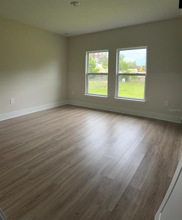 524 Marion Oaks Blvd, Ocala, FL 34473 - unfurnished room featuring wood finished floors and baseboards