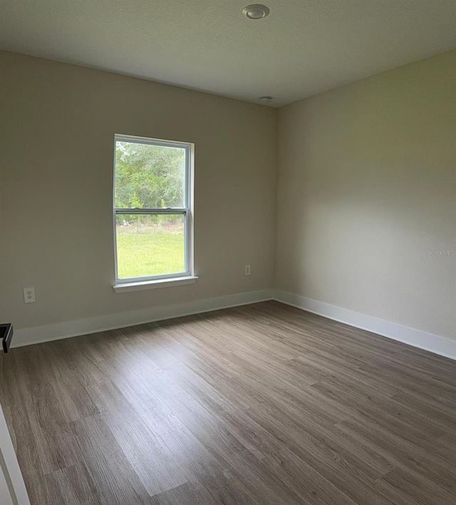 524 Marion Oaks Blvd, Ocala, FL 34473 - spare room featuring wood finished floors, baseboards, and recessed lighting