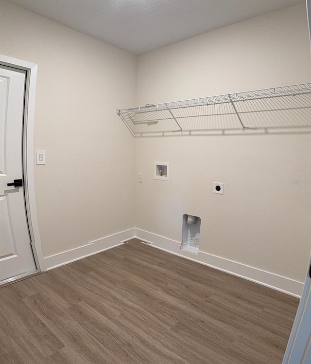 524 Marion Oaks Blvd, Ocala, FL 34473 - laundry area with dark wood-style flooring, baseboards, hookup for an electric dryer, and washer hookup