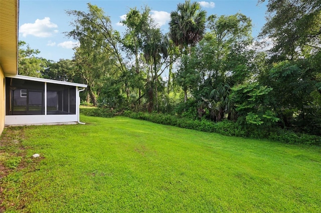 395 Alcazar Ave, De Leon Springs, FL 32130 - view of grassy yard with a sunroom