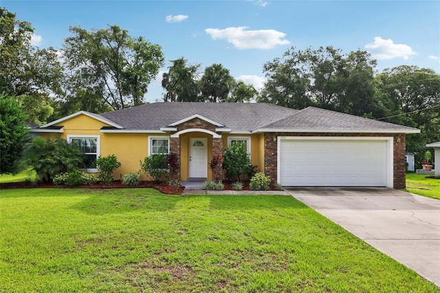 395 Alcazar Ave, De Leon Springs, FL 32130 - ranch-style home featuring a garage, concrete driveway, a front yard, and stone siding