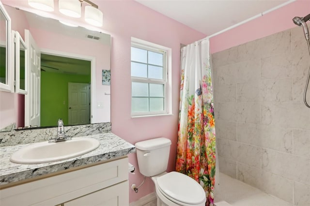 395 Alcazar Ave, De Leon Springs, FL 32130 - full bathroom with toilet, vanity, and tiled shower