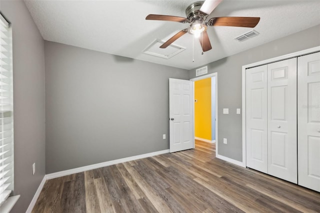 395 Alcazar Ave, De Leon Springs, FL 32130 - unfurnished bedroom with wood finished floors, a closet, and baseboards