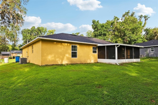 395 Alcazar Ave, De Leon Springs, FL 32130 - back of house with a sunroom, stucco siding, and a yard