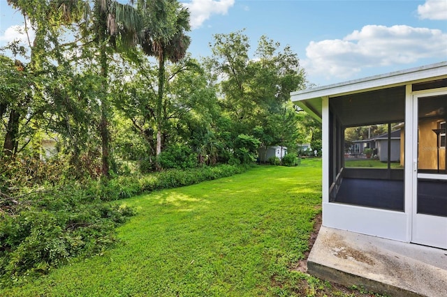 395 Alcazar Ave, De Leon Springs, FL 32130 - view of green lawn with a sunroom