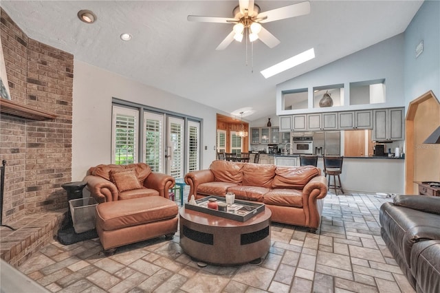616 Magnolia St, Windermere, FL 34786 - living room featuring a ceiling fan, a skylight, high vaulted ceiling, and recessed lighting