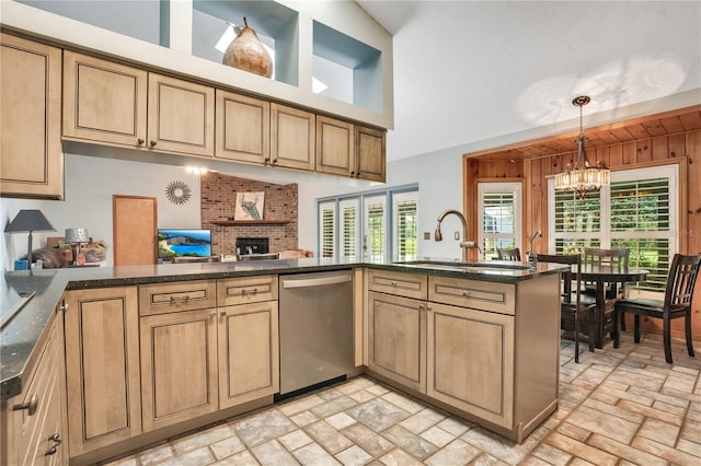 616 Magnolia St, Windermere, FL 34786 - kitchen with dishwasher, a chandelier, pendant lighting, a brick fireplace, and a peninsula