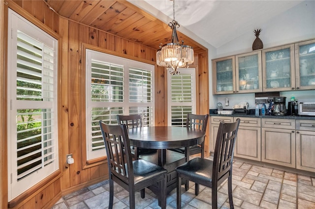 616 Magnolia St, Windermere, FL 34786 - dining area with a chandelier, wooden walls, and vaulted ceiling