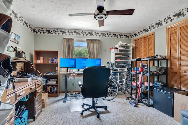 616 Magnolia St, Windermere, FL 34786 - home office featuring ceiling fan, carpet flooring, and a textured ceiling