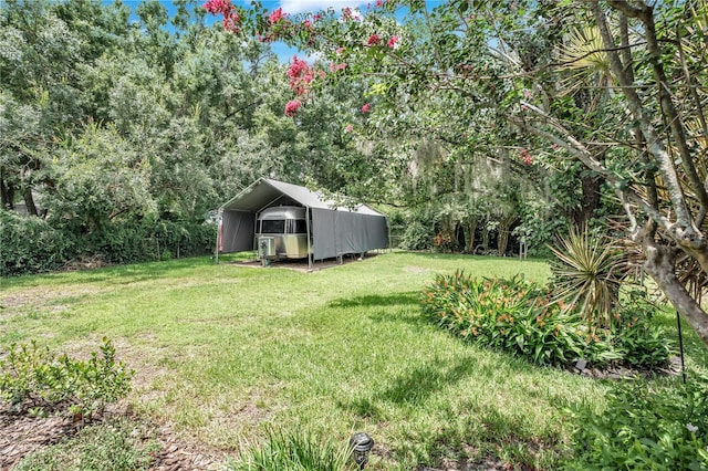 616 Magnolia St, Windermere, FL 34786 - view of green lawn with a carport
