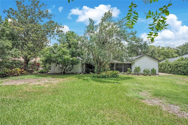 616 Magnolia St, Windermere, FL 34786 - view of green lawn featuring a sunroom