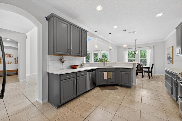 15318 Sandfield Loop, Winter Garden, FL 34787 - kitchen with gray cabinets, dishwasher, arched walkways, a peninsula, and ornamental molding