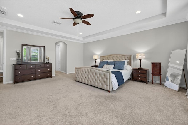 15318 Sandfield Loop, Winter Garden, FL 34787 - bedroom with a raised ceiling, arched walkways, carpet, baseboards, and recessed lighting