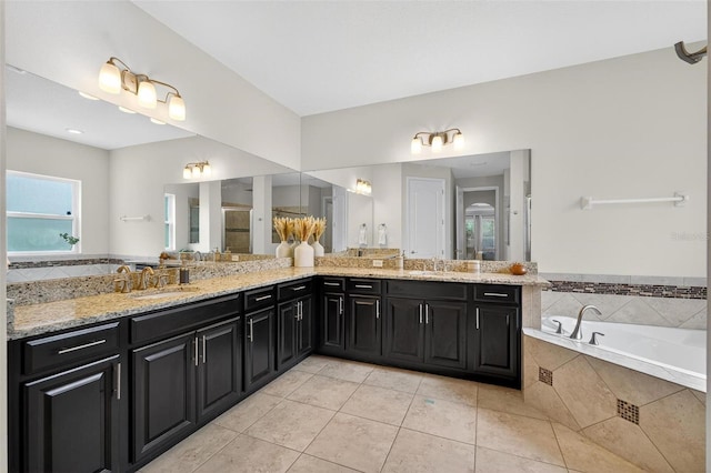 15318 Sandfield Loop, Winter Garden, FL 34787 - bathroom with tile patterned floors, double vanity, and a garden tub