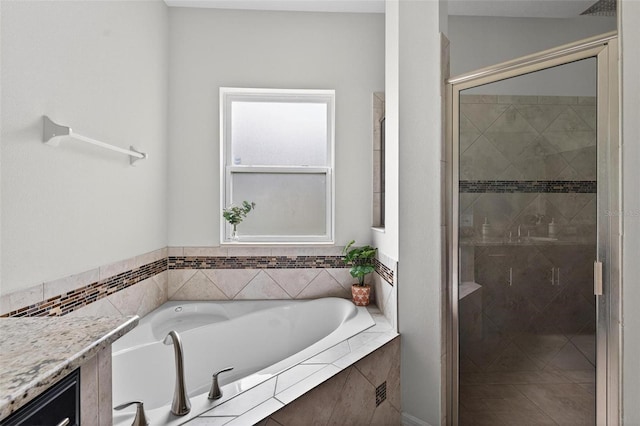 15318 Sandfield Loop, Winter Garden, FL 34787 - bathroom featuring a garden tub and a shower stall