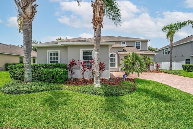 15318 Sandfield Loop, Winter Garden, FL 34787 - view of front of house featuring stucco siding and driveway