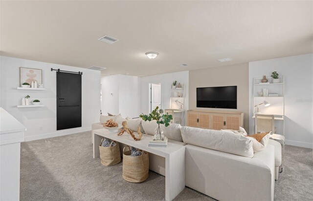 6005 Blue View Way, Saint Cloud, FL 34771 - living room featuring light colored carpet, a barn door, and baseboards