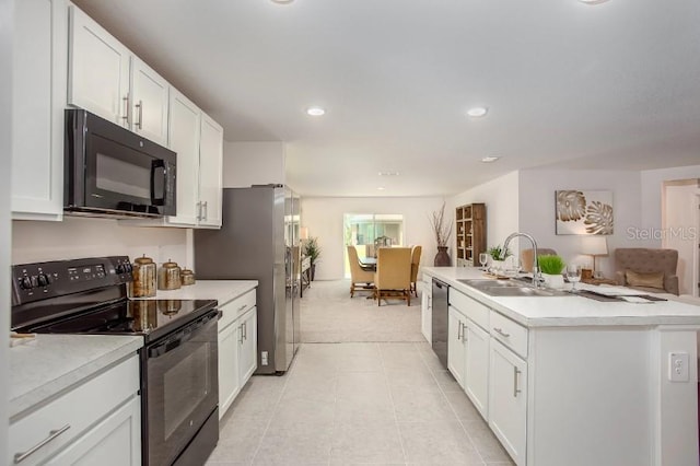 8624 N Pitcairn Way, Citrus Springs, FL 34434 - kitchen featuring black appliances, a sink, light countertops, light colored carpet, and white cabinets