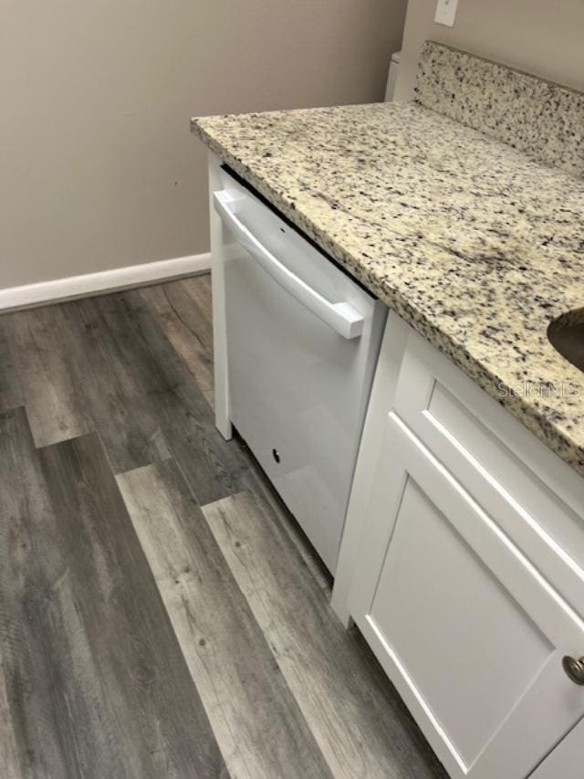 2776 Curry Ford Rd Ge, Unit Ge, Orlando, FL 32806 - kitchen view of white dishwasher, wood finished floors, light stone countertops, and white cabinets