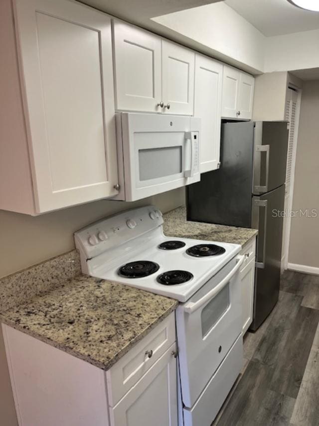 2776 Curry Ford Rd Ge, Unit Ge, Orlando, FL 32806 - kitchen featuring white appliances, white cabinets, dark wood finished floors, and light stone countertops