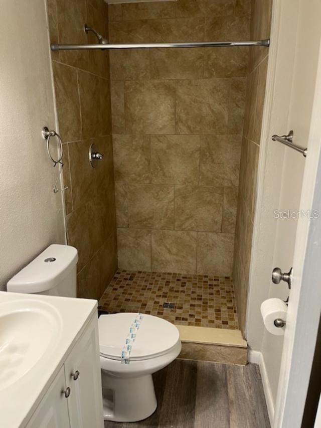 2776 Curry Ford Rd Ge, Unit Ge, Orlando, FL 32806 - bathroom featuring wood finished floors, vanity, and a shower stall