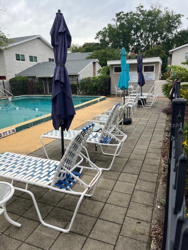 2776 Curry Ford Rd Ge, Unit Ge, Orlando, FL 32806 - community pool with a patio area