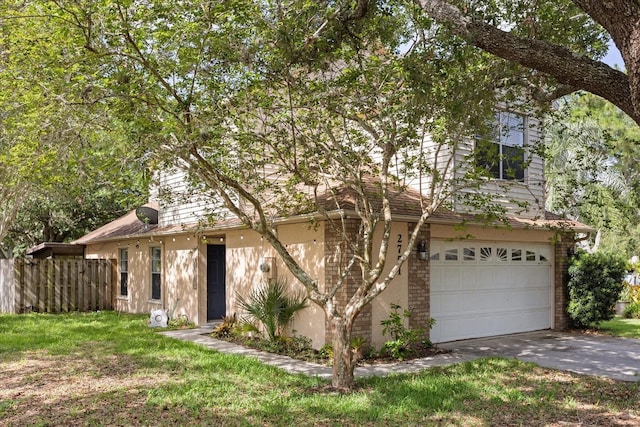 2751 Wentworth Pl, Cocoa, FL 32926 - view of front of house featuring concrete driveway, an attached garage, and brick siding