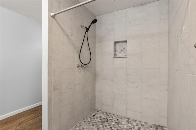 2751 Wentworth Pl, Cocoa, FL 32926 - bathroom with tiled shower and wood finished floors