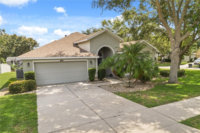 2696 Clearview St, Clermont, FL 34711 - view of front of house featuring stucco siding, an attached garage, concrete driveway, roof with shingles, and a front yard