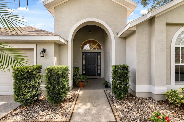 2696 Clearview St, Clermont, FL 34711 - entrance to property with stucco siding and an attached garage