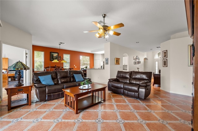 2696 Clearview St, Clermont, FL 34711 - living area with arched walkways and ceiling fan