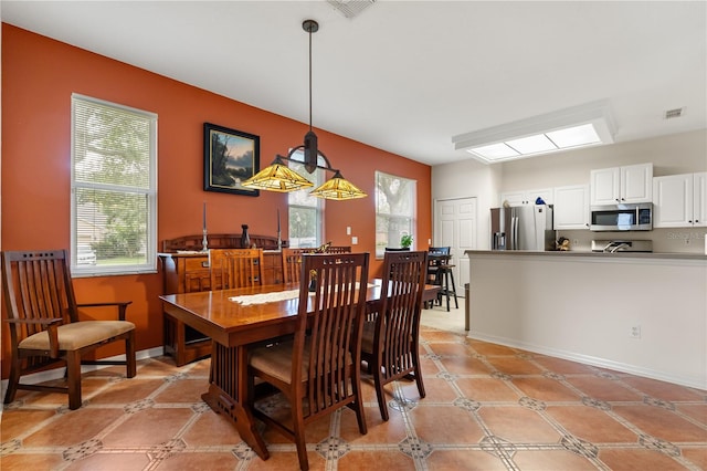 2696 Clearview St, Clermont, FL 34711 - dining room featuring healthy amount of natural light and light tile patterned floors