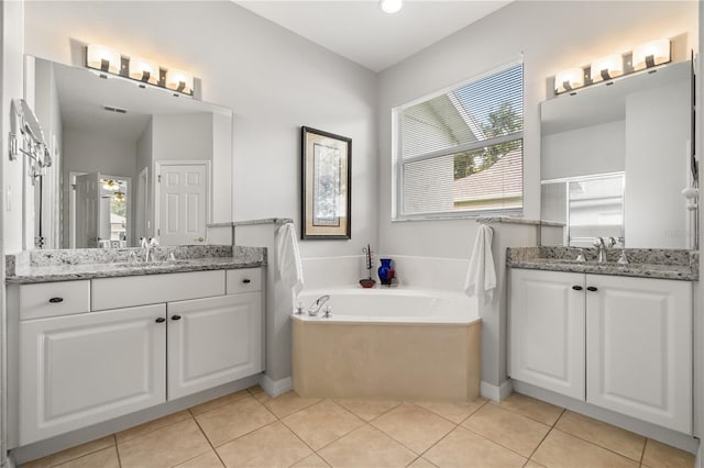 2696 Clearview St, Clermont, FL 34711 - bathroom featuring two vanities, a garden tub, tile patterned flooring, and an enclosed shower