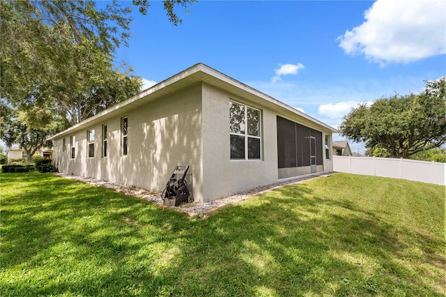 2696 Clearview St, Clermont, FL 34711 - view of side of property featuring a sunroom and stucco siding