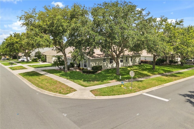 2696 Clearview St, Clermont, FL 34711 - view of front of property with a front yard, a garage, and driveway