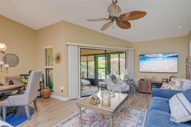 5323 Concord Way, Fort Myers, FL 33907 - living room featuring light wood-style flooring, lofted ceiling, ceiling fan, baseboards, and a chandelier