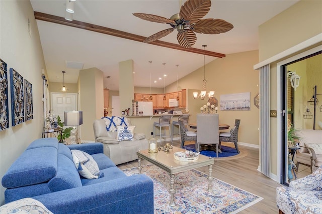5323 Concord Way, Fort Myers, FL 33907 - living area featuring vaulted ceiling, a ceiling fan, light wood-style flooring, baseboards, and a chandelier