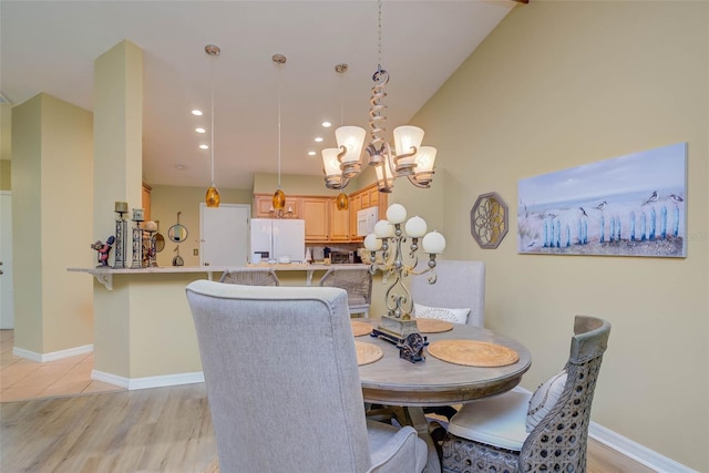 5323 Concord Way, Fort Myers, FL 33907 - dining area with a chandelier, light wood finished floors, recessed lighting, and baseboards