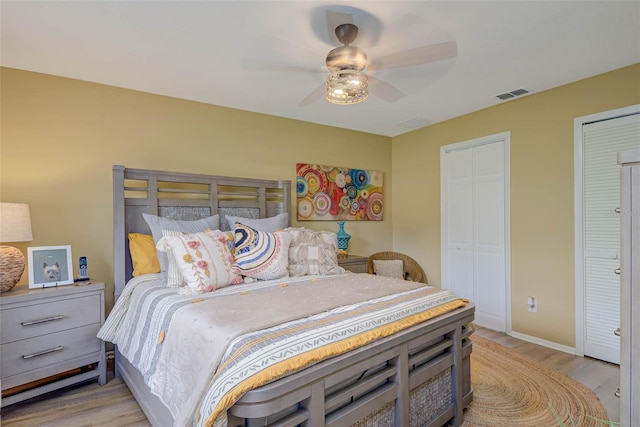 5323 Concord Way, Fort Myers, FL 33907 - bedroom featuring light wood-type flooring, multiple closets, a ceiling fan, and baseboards