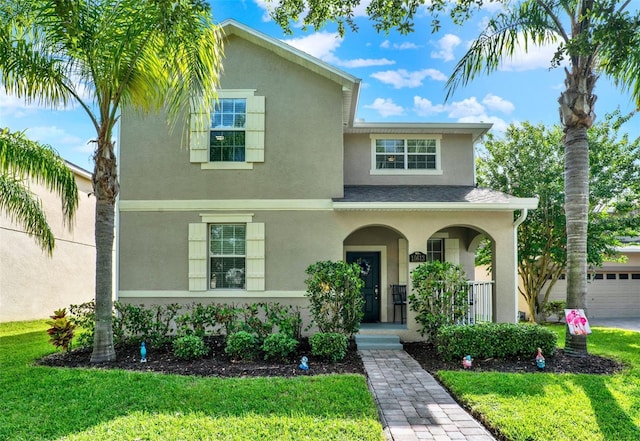 15613 Camp Dubois Cres, Winter Garden, FL 34787 - view of front of property with stucco siding, a porch, and a front yard