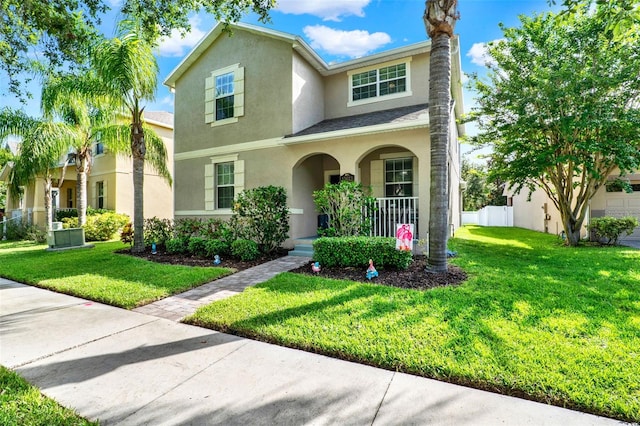 15613 Camp Dubois Cres, Winter Garden, FL 34787 - traditional-style home featuring a porch, stucco siding, and a front lawn