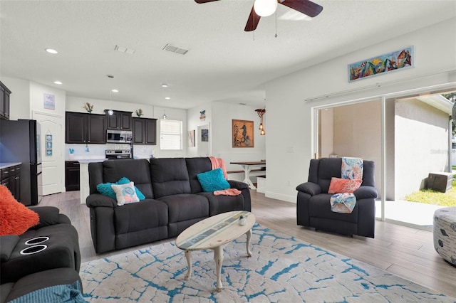 15613 Camp Dubois Cres, Winter Garden, FL 34787 - living area with light wood-style floors, ceiling fan, and recessed lighting