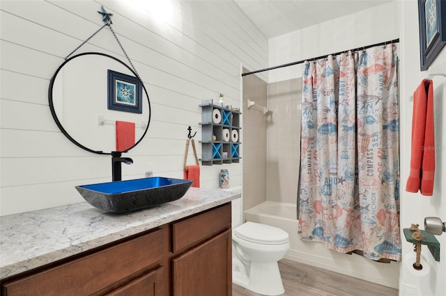 15613 Camp Dubois Cres, Winter Garden, FL 34787 - bathroom with toilet, vanity, shower / bath combination with curtain, and wood finished floors