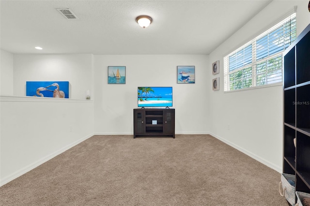 15613 Camp Dubois Cres, Winter Garden, FL 34787 - unfurnished living room featuring carpet flooring and baseboards