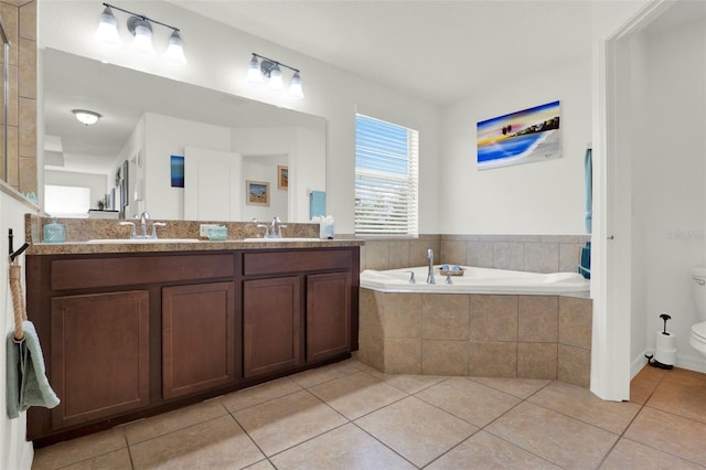 15613 Camp Dubois Cres, Winter Garden, FL 34787 - bathroom with tile patterned floors, toilet, a bath, and double vanity