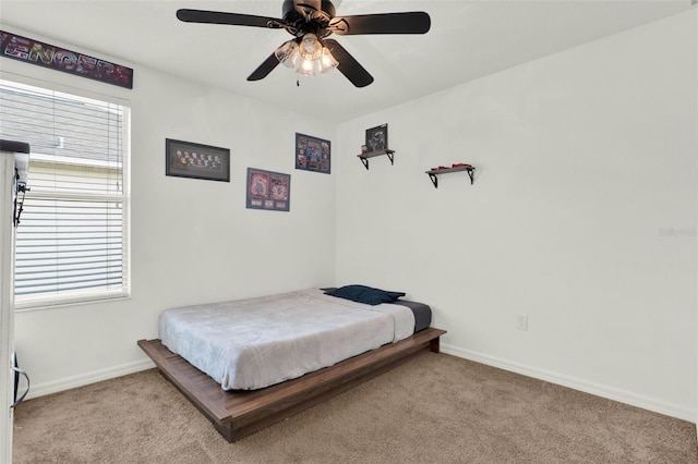 15613 Camp Dubois Cres, Winter Garden, FL 34787 - carpeted bedroom featuring baseboards, multiple windows, and a ceiling fan